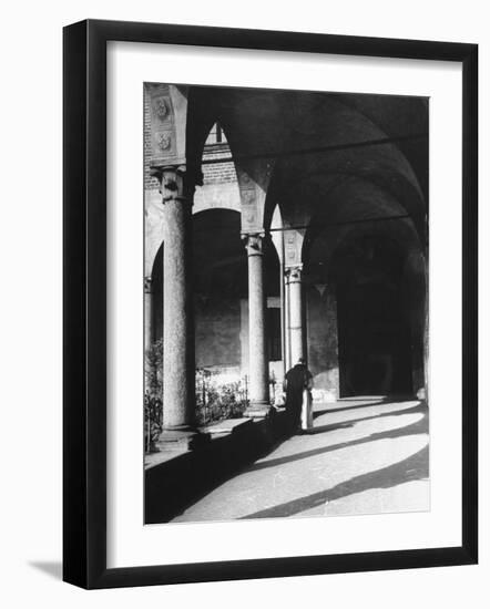 View of a Monk Walking the Grounds of a Church in Milan-Carl Mydans-Framed Photographic Print