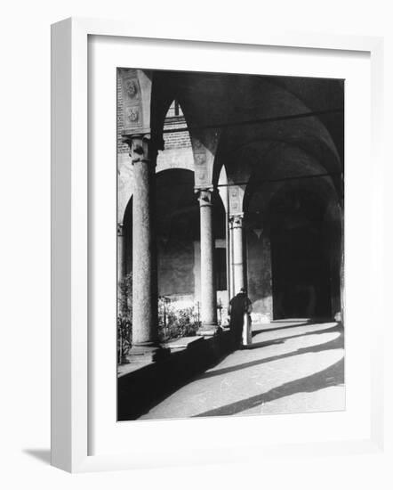 View of a Monk Walking the Grounds of a Church in Milan-Carl Mydans-Framed Photographic Print