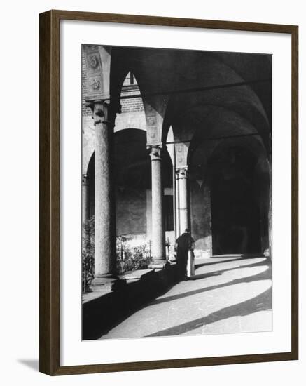 View of a Monk Walking the Grounds of a Church in Milan-Carl Mydans-Framed Photographic Print