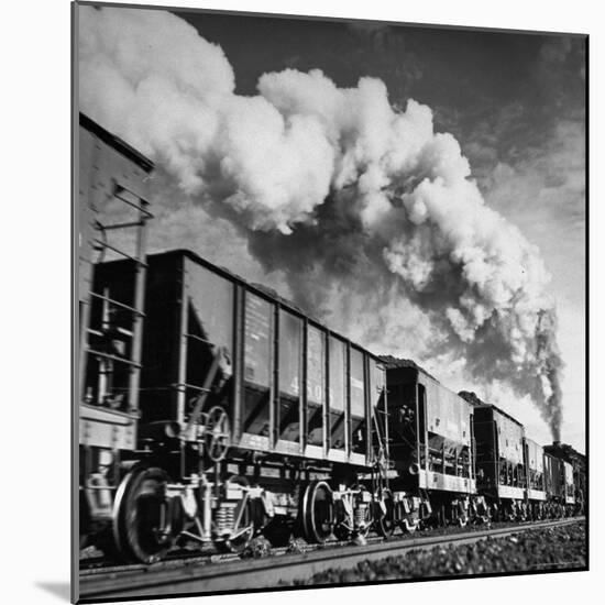 View of a Railcar Loaded with Iron Ore Moving Along the Tracks-Charles E^ Steinheimer-Mounted Photographic Print