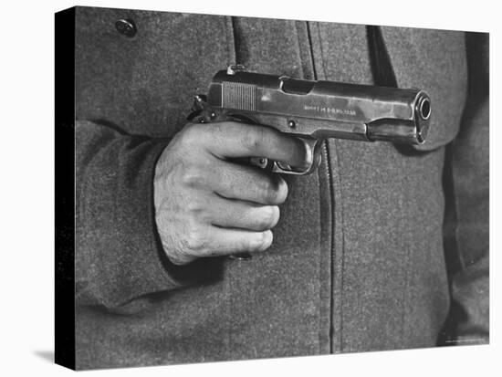 View of a Soldier Holding a US Army Colt Automatic .45 Caliber Pistol-William Vandivert-Stretched Canvas