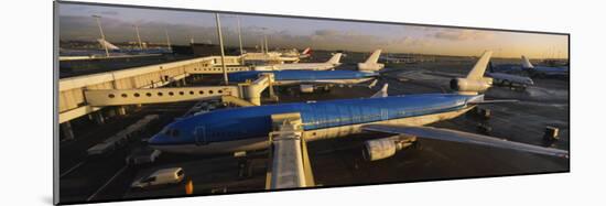 View of Airplanes at an Airport, Amsterdam Schiphol Airport, Amsterdam, Netherlands-null-Mounted Photographic Print