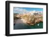 View of beach and old town on limestone cliffs, Polignano a Mare, Puglia, Italy, Europe-Karen Deakin-Framed Photographic Print