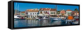 View of cafes and shops in Fiscardo harbour, Fiscardo, Kefalonia, Ionian Islands, Greek Islands-Frank Fell-Framed Stretched Canvas