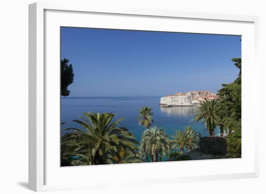 View of City across the Sea and Through Palm Trees-John Miller-Framed Photographic Print