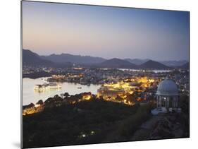 View of City Palace and Lake Palace Hotel at Sunset, Udaipur, Rajasthan, India, Asia-Ian Trower-Mounted Photographic Print