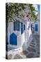 View of girl walking through whitewashed narrow street, Mykonos Town-Frank Fell-Stretched Canvas