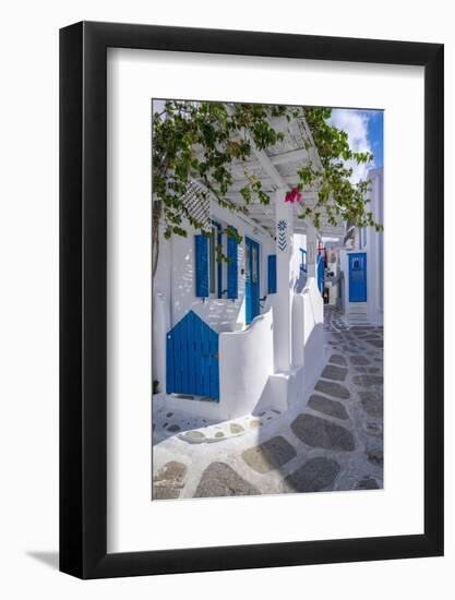 View of girl walking through whitewashed narrow street, Mykonos Town-Frank Fell-Framed Photographic Print