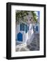 View of girl walking through whitewashed narrow street, Mykonos Town-Frank Fell-Framed Photographic Print