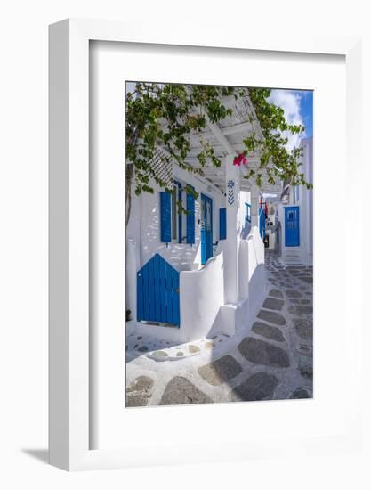 View of girl walking through whitewashed narrow street, Mykonos Town-Frank Fell-Framed Photographic Print