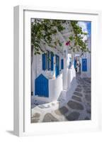 View of girl walking through whitewashed narrow street, Mykonos Town-Frank Fell-Framed Photographic Print