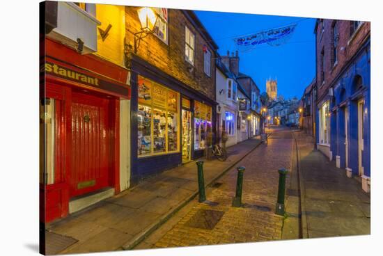 View of illuminated Lincoln Cathedral viewed from the cobbled Steep Hill at dusk, Lincoln, Lincolns-Frank Fell-Stretched Canvas