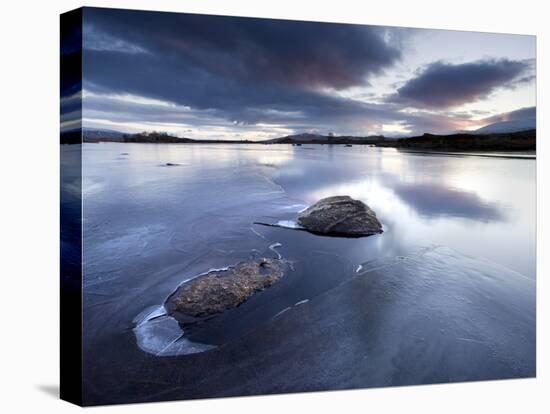 View of Loch Ba' at Dawn, Loch Partly Frozen With Two Large Rocks Protruding From the Ice, Scotland-Lee Frost-Stretched Canvas