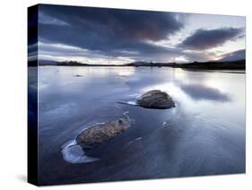 View of Loch Ba' at Dawn, Loch Partly Frozen With Two Large Rocks Protruding From the Ice, Scotland-Lee Frost-Stretched Canvas