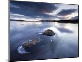 View of Loch Ba' at Dawn, Loch Partly Frozen With Two Large Rocks Protruding From the Ice, Scotland-Lee Frost-Mounted Photographic Print