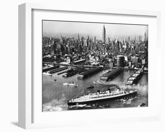 View of New York City Skyline with the S.S. Queen Mary Docking at the 51st Street Pier-null-Framed Photographic Print