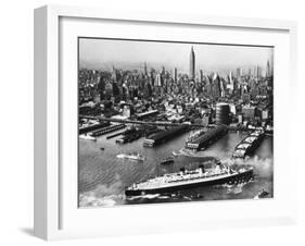 View of New York City Skyline with the S.S. Queen Mary Docking at the 51st Street Pier-null-Framed Photographic Print