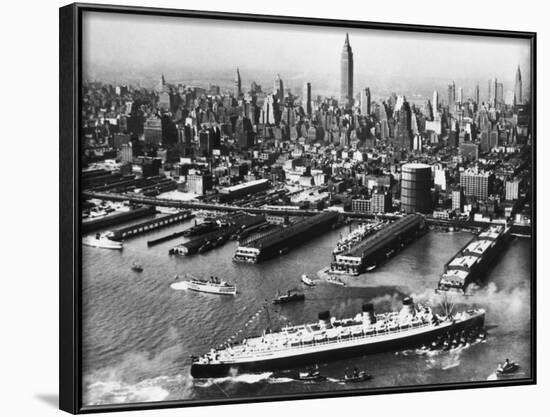 View of New York City Skyline with the S.S. Queen Mary Docking at the 51st Street Pier-null-Framed Photographic Print