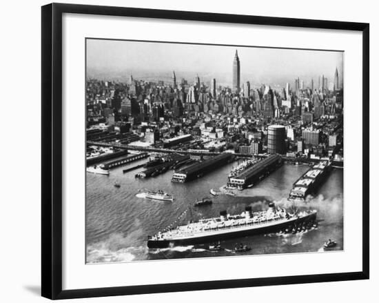 View of New York City Skyline with the S.S. Queen Mary Docking at the 51st Street Pier-null-Framed Photographic Print