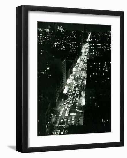 View of New York Illuminated at Night, Traffic Stretches for Miles as Cars Pour into the City-null-Framed Photographic Print