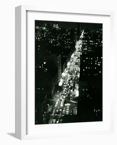 View of New York Illuminated at Night, Traffic Stretches for Miles as Cars Pour into the City-null-Framed Photographic Print