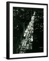 View of New York Illuminated at Night, Traffic Stretches for Miles as Cars Pour into the City-null-Framed Photographic Print