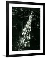 View of New York Illuminated at Night, Traffic Stretches for Miles as Cars Pour into the City-null-Framed Photographic Print