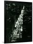 View of New York Illuminated at Night, Traffic Stretches for Miles as Cars Pour into the City-null-Framed Photographic Print