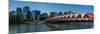 View of Peace Bridge with skylines in the background, Bow River, Calgary, Alberta, Canada-null-Mounted Photographic Print