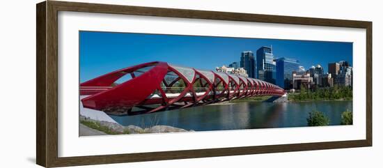 View of Peace Bridge with skylines in the background, Bow River, Calgary, Alberta, Canada-null-Framed Photographic Print