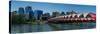 View of Peace Bridge with skylines in the background, Bow River, Calgary, Alberta, Canada-null-Stretched Canvas
