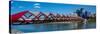 View of Peace Bridge with skylines in the background, Bow River, Calgary, Alberta, Canada-null-Stretched Canvas