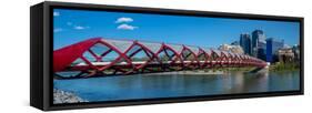 View of Peace Bridge with skylines in the background, Bow River, Calgary, Alberta, Canada-null-Framed Stretched Canvas
