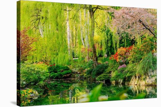 View of pond in garden, Butchart Gardens, Vancouver Island, British Columbia, Canada-Pete Saloutos-Stretched Canvas