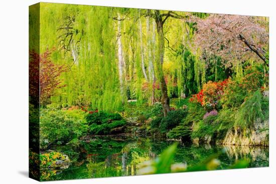 View of pond in garden, Butchart Gardens, Vancouver Island, British Columbia, Canada-Pete Saloutos-Stretched Canvas