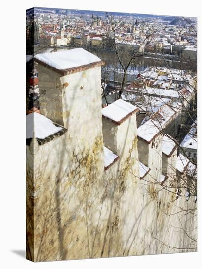 View of Prague from Snow-Covered Gothic Hunger Wall on Petrin Hill, Prague, Czech Republic-Richard Nebesky-Stretched Canvas