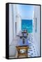 View of sea and restaurant tables in Mykonos Town, Mykonos, Cyclades Islands, Aegean Sea-Frank Fell-Framed Stretched Canvas