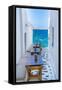 View of sea and restaurant tables in Mykonos Town, Mykonos, Cyclades Islands, Aegean Sea-Frank Fell-Framed Stretched Canvas