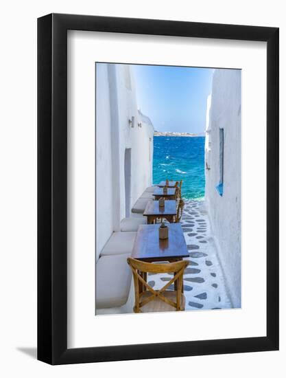 View of sea and restaurant tables in Mykonos Town, Mykonos, Cyclades Islands, Aegean Sea-Frank Fell-Framed Photographic Print