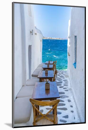 View of sea and restaurant tables in Mykonos Town, Mykonos, Cyclades Islands, Aegean Sea-Frank Fell-Mounted Photographic Print