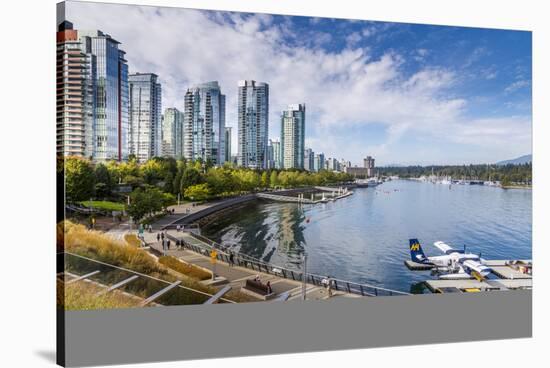 View of seaplane and urban office buildings around Vancouver Harbour, Downtown, Vancouver, British -Frank Fell-Stretched Canvas