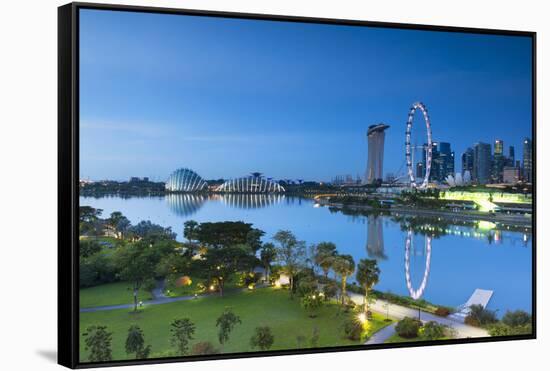 View of Singapore Flyer, Marina Bay Sands Hotel and Gardens by the Bay at dawn, Singapore-Ian Trower-Framed Stretched Canvas