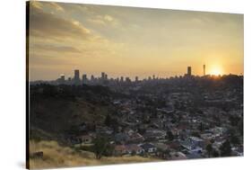 View of skyline at sunset, Johannesburg, Gauteng, South Africa, Africa-Ian Trower-Stretched Canvas