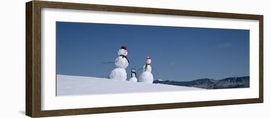 View of Snowmen in Snow Covered Landscape, Waterbury, Vermont, USA-null-Framed Photographic Print