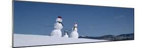 View of Snowmen in Snow Covered Landscape, Waterbury, Vermont, USA-null-Mounted Photographic Print
