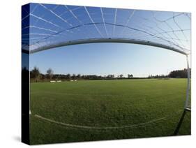 View of Soccer Field Through Goal-Steven Sutton-Stretched Canvas
