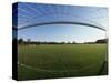 View of Soccer Field Through Goal-Steven Sutton-Stretched Canvas