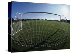 View of Soccer Field Through Goal-Steven Sutton-Stretched Canvas