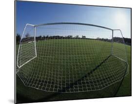 View of Soccer Field Through Goal-Steven Sutton-Mounted Photographic Print