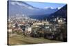 View of the city of Chur surrounded by woods and snowy peaks, district of Plessur, Canton of Graubu-Roberto Moiola-Stretched Canvas